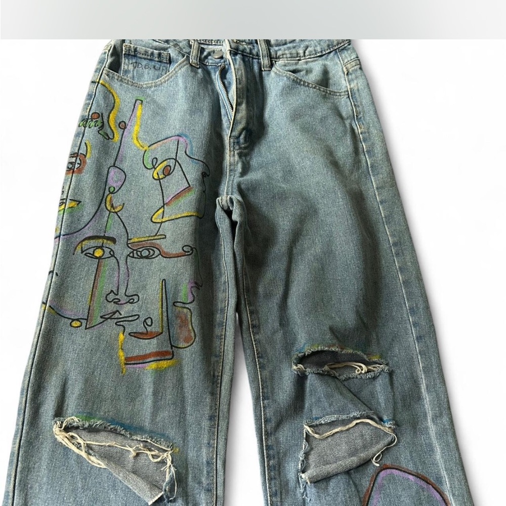 Artistic Ripped Jeans with Colorful Face Design